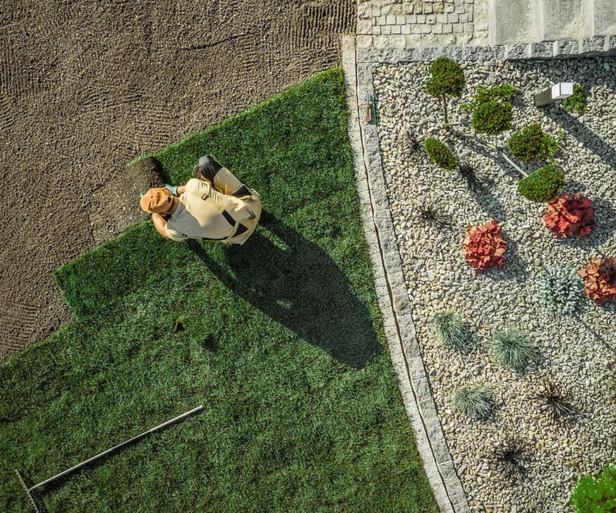 Rolling out grass onto a yard